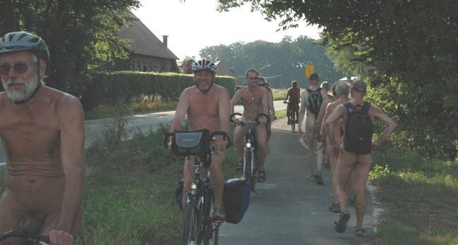 Nude cyclists encounter hikers in the buff